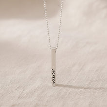 silver bar pendant with JACKSON and HAILEY hand stamped
