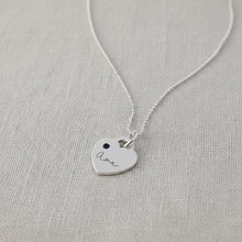 Silver necklace with a heart-shaped pendant 